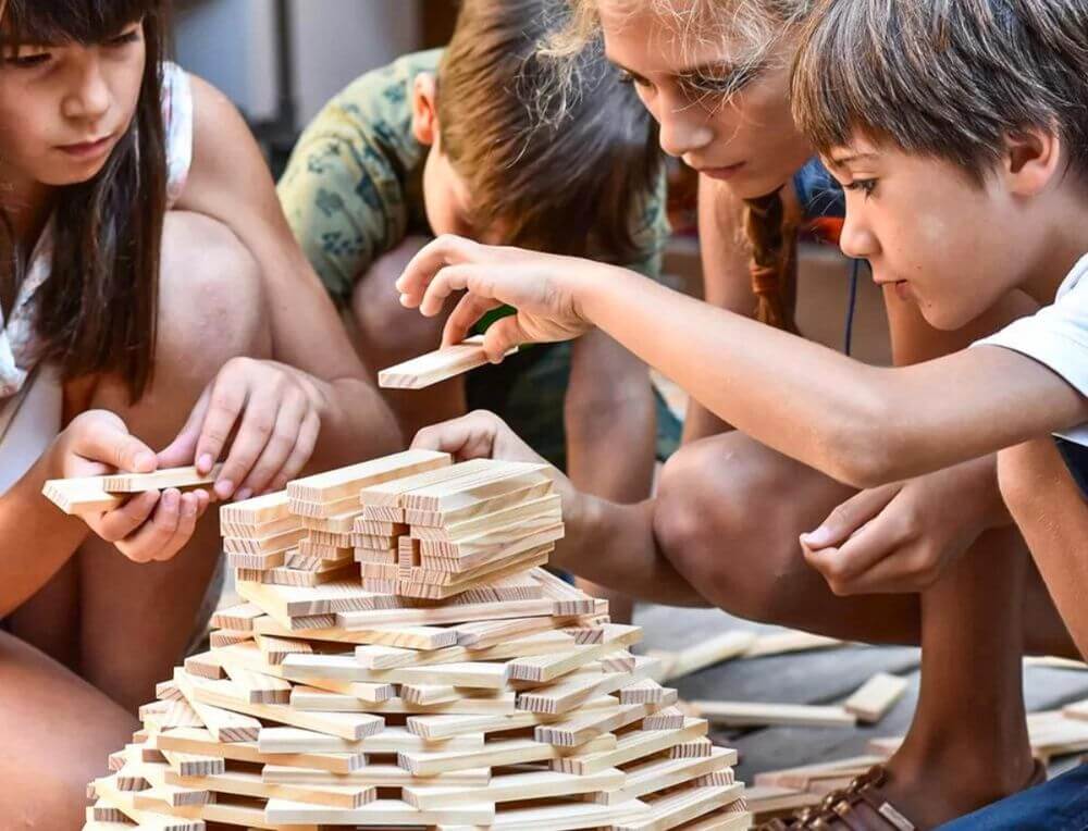 Children building with KAPLA construction planks in a Steiner classroom setting