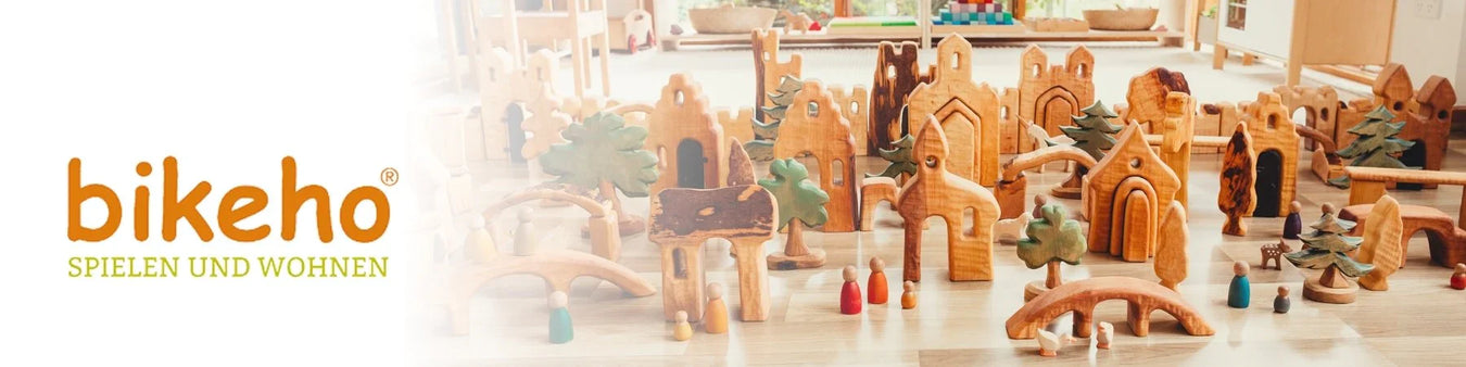 Bikeho handcrafted wooden trees, houses, castles, and bridges in a small world playscape from Mercurius Australia